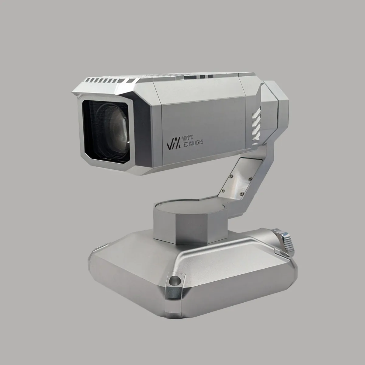 VION NEXA, three-quarter view: zoom head on a three-axis gimbal, CNC-machined aluminium base, studio photo with marked parts
